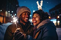 Couple holding glow sticks outdoors winter adult. AI generated Image by rawpixel.