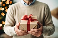 Christmas gift holding adult man. AI generated Image by rawpixel.