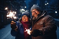 Couple holding glow sticks sparkler outdoors sparks. AI generated Image by rawpixel.