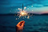 Night hand fireworks sparkler. AI generated Image by rawpixel.