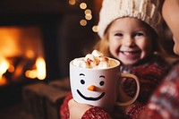 Snowman face cup christmas fireplace. AI generated Image by rawpixel.