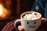 Snowman face cup fireplace holiday. AI generated Image by rawpixel.