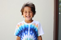 Kid wearing tie dye t-shirt laughing portrait smile. AI generated Image by rawpixel.