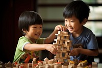 Asian kids building blocks child toy togetherness. AI generated Image by rawpixel.