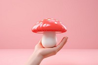 Mushroom holding agaric fungus. AI generated Image by rawpixel.