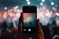 Smartphone taking picture of concert