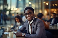 Young African business man glasses sitting office. 