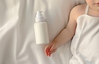 White lotion package baby portrait photo. AI generated Image by rawpixel.