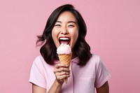 Asian woman licks delicious ice cream dessert adult food. 