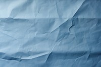 Paper backgrounds wrinkled blue. AI generated Image by rawpixel.