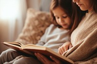 Reading child cozy book. AI generated Image by rawpixel.