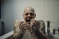 Skinhead man bathroom face aggression. AI generated Image by rawpixel.