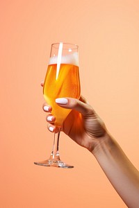 Hand holding beer glass drink refreshment champagne. AI generated Image by rawpixel.