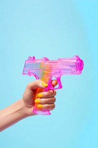 Hand holding water gun toy weapon aggression medication. AI generated Image by rawpixel.