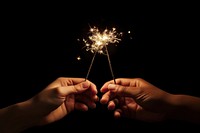 Two hands holding sparklers fireworks finger sparks. AI generated Image by rawpixel.