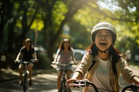 Indonesian friends bicycle laughing vehicle. AI generated Image by rawpixel.