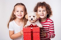 A happy kids hold gift box mammal child dog. AI generated Image by rawpixel.