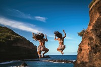 People jumping out of a cliff in front of transparent sea adult togetherness adventure. AI generated Image by rawpixel.