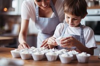 Preparing cup Cake kitchen dessert child. AI generated Image by rawpixel.