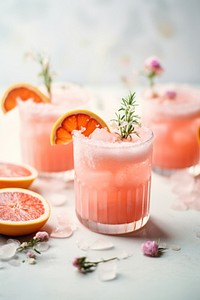 Grapefruit gin fizz cocktail drink glass table. AI generated Image by rawpixel.