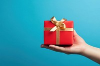 Red gift box ribbon gold blue. AI generated Image by rawpixel.