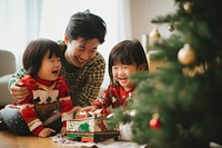 PNG Christmas sitting family adult. AI generated Image by rawpixel.