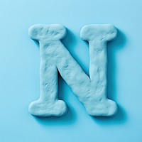 N letters plasticine text turquoise blue. AI generated Image by rawpixel.