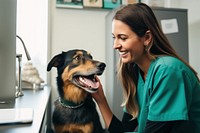 Female veterinarian talking dog mammal animal. 