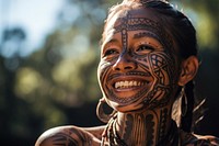 Indigenous woman tattoo smiling tribe. AI generated Image by rawpixel.