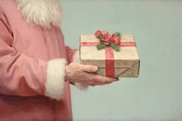 Santa hand holding present box adult celebration decoration. AI generated Image by rawpixel.