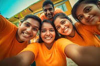 Four indians wear volunteer shirts portrait selfie camera. AI generated Image by rawpixel.