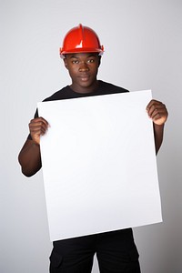 A african fireman portrait holding hardhat. 