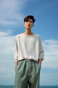 Korean man wear minimal fashionable portrait sleeve sky. AI generated Image by rawpixel.