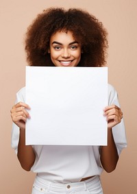 A latin woman portrait holding paper. 