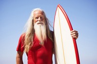 South African senior man surfboard standing outdoors. 