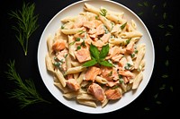 Creamy salmon pasta plate food meal. AI generated Image by rawpixel.
