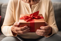 Senior woman gift box celebration. AI generated Image by rawpixel.