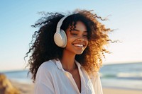 Black woman with long hair headphones listening smiling. AI generated Image by rawpixel.