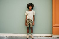 Black kid smiling shorts child. AI generated Image by rawpixel.