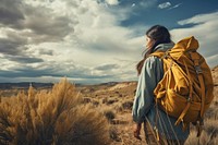Latino woman backpack desert hiking. AI generated Image by rawpixel.