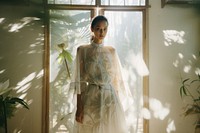 Thai designer and her design fashion wedding dress. AI generated Image by rawpixel.