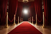 Red carpet with red carpet and red curtains gold architecture illuminated. 