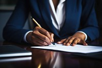 African Businesswoman signing agreement paper writing pen handwriting. 