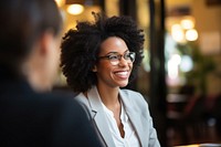 Beautiful smiling African business lady chatting with coworker glasses adult smile. AI generated Image by rawpixel.