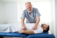 Physiotherapist patient adult man. 