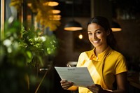 Photo of service woman holding the menu yellow entrepreneur architecture. 