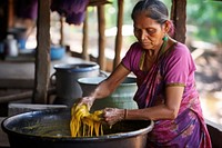 Making dye fabric adult woman tradition. AI generated Image by rawpixel.