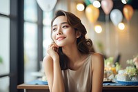 South east asia woman portrait sitting happy. AI generated Image by rawpixel.