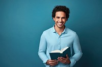 A smile student adult men holding book portrait reading intelligence. AI generated Image by rawpixel.