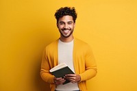A smile student latino men holding book portrait adult intelligence. AI generated Image by rawpixel.